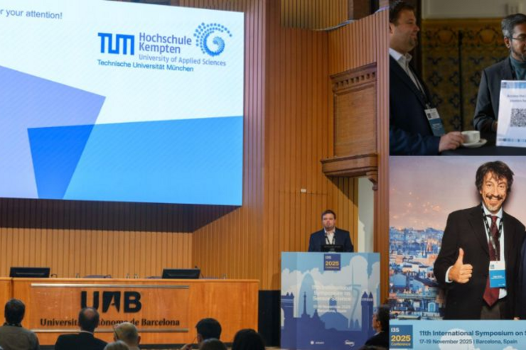 Promovend Patrick Huber stellt seine Forschungsergebnisse auf der Konferenz I3S vor einem großen Publikum vor. 