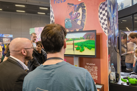 Bayerns Digitalminister Dr. Fabian Mehring testet das Spiel Fiets-Together auf der GG Bavaria 2026